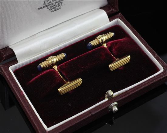 A pair of 1980s French 18ct gold and cabochon sapphire set cufflinks, retailed by Asprey & Co Ltd,